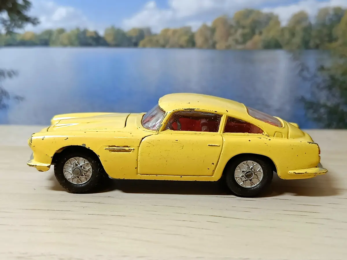 218 Aston Martin In Yellow With Cast Wheels 1