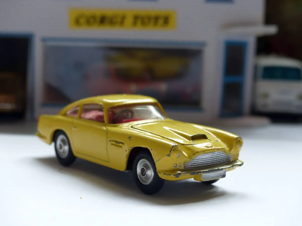 218 Aston Martin In Yellow With Fixed Wheels And Open Vent 1
