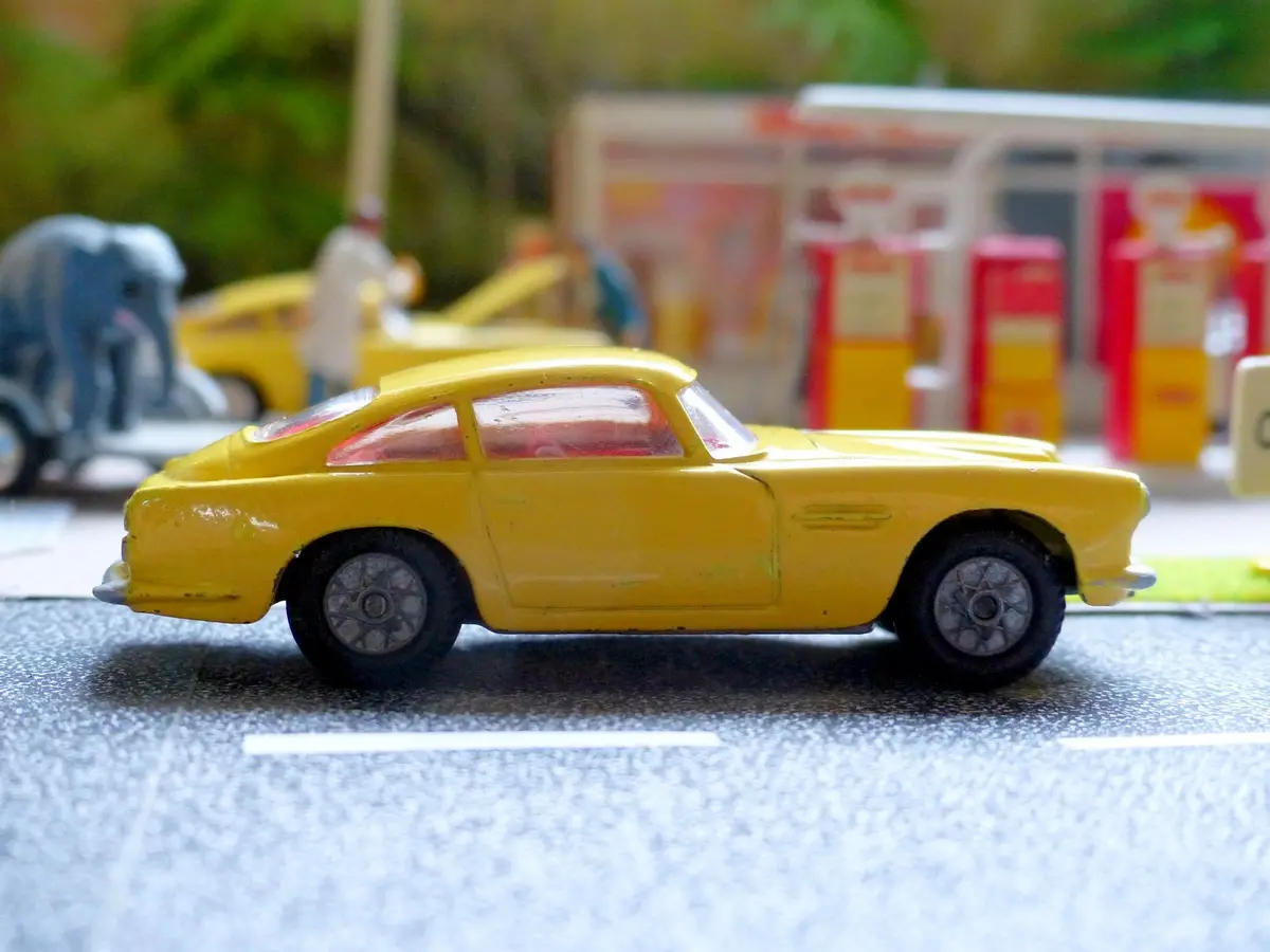 218 Aston Martin In Yellow With Cast Wheels 1
